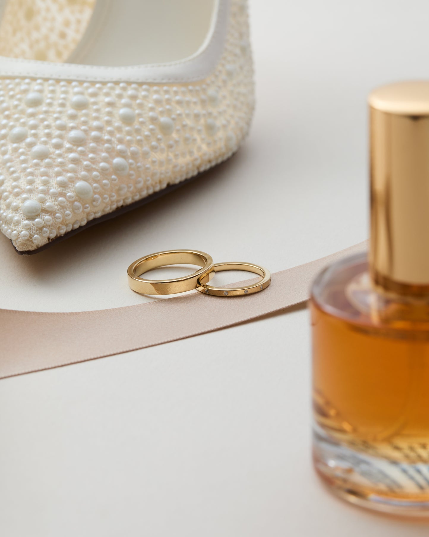 Matching men's and women's gold wedding band set, handmade in Nashville