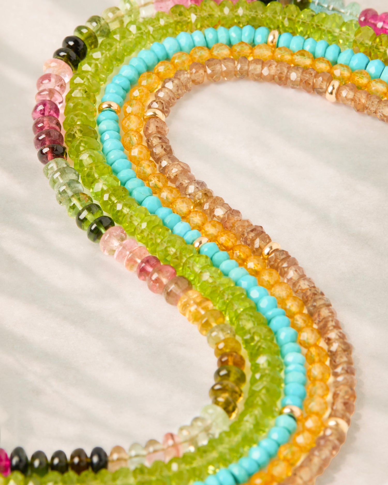 Colorful gemstone bracelets with solid gold clasp in Nashville, Tennessee