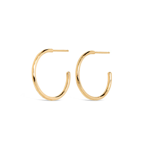 Gold hoop earrings with a hammered texture, handmade in Nashville, TN