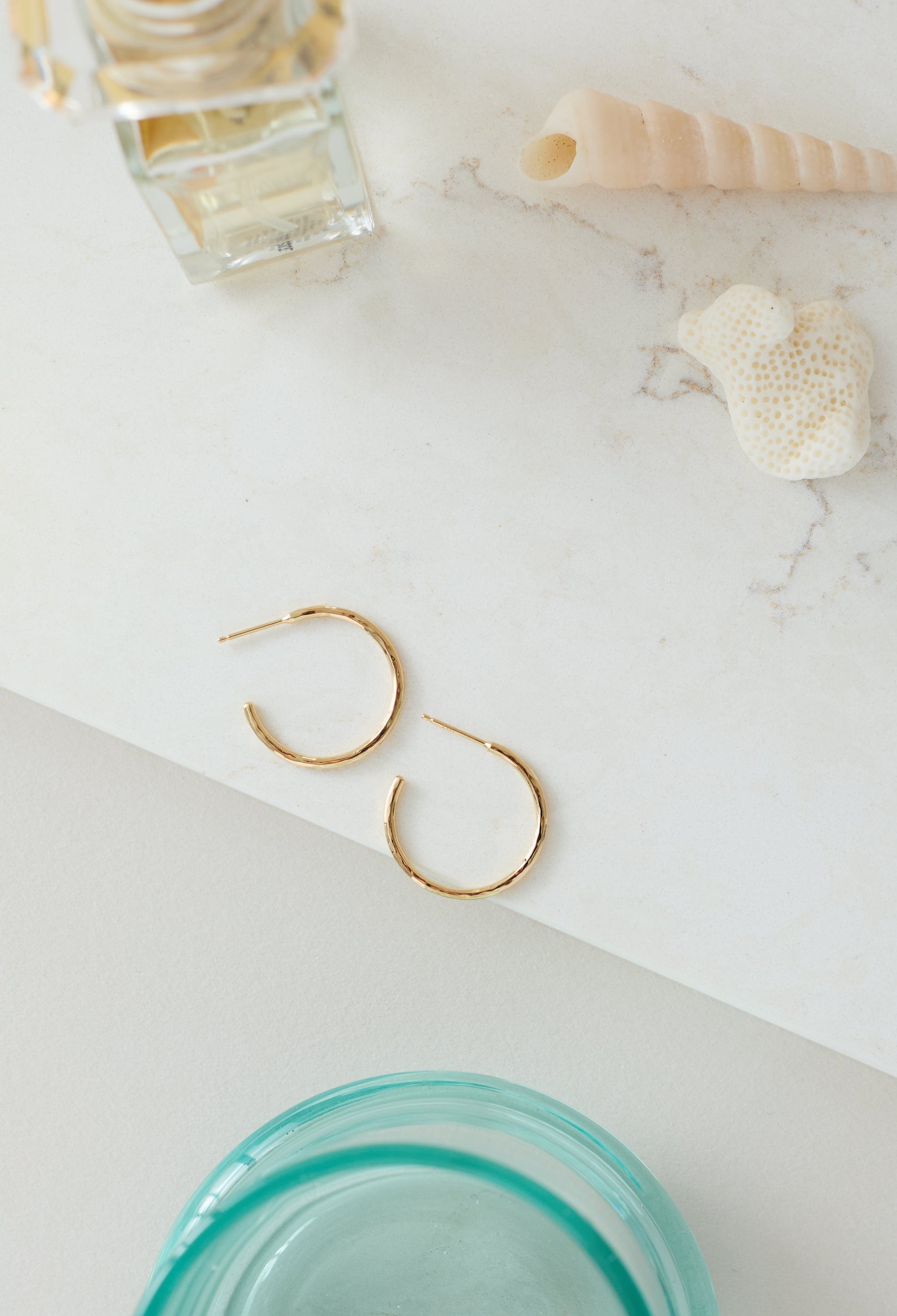 Gold hoop earrings with a hammered texture, handmade in Nashville, TN