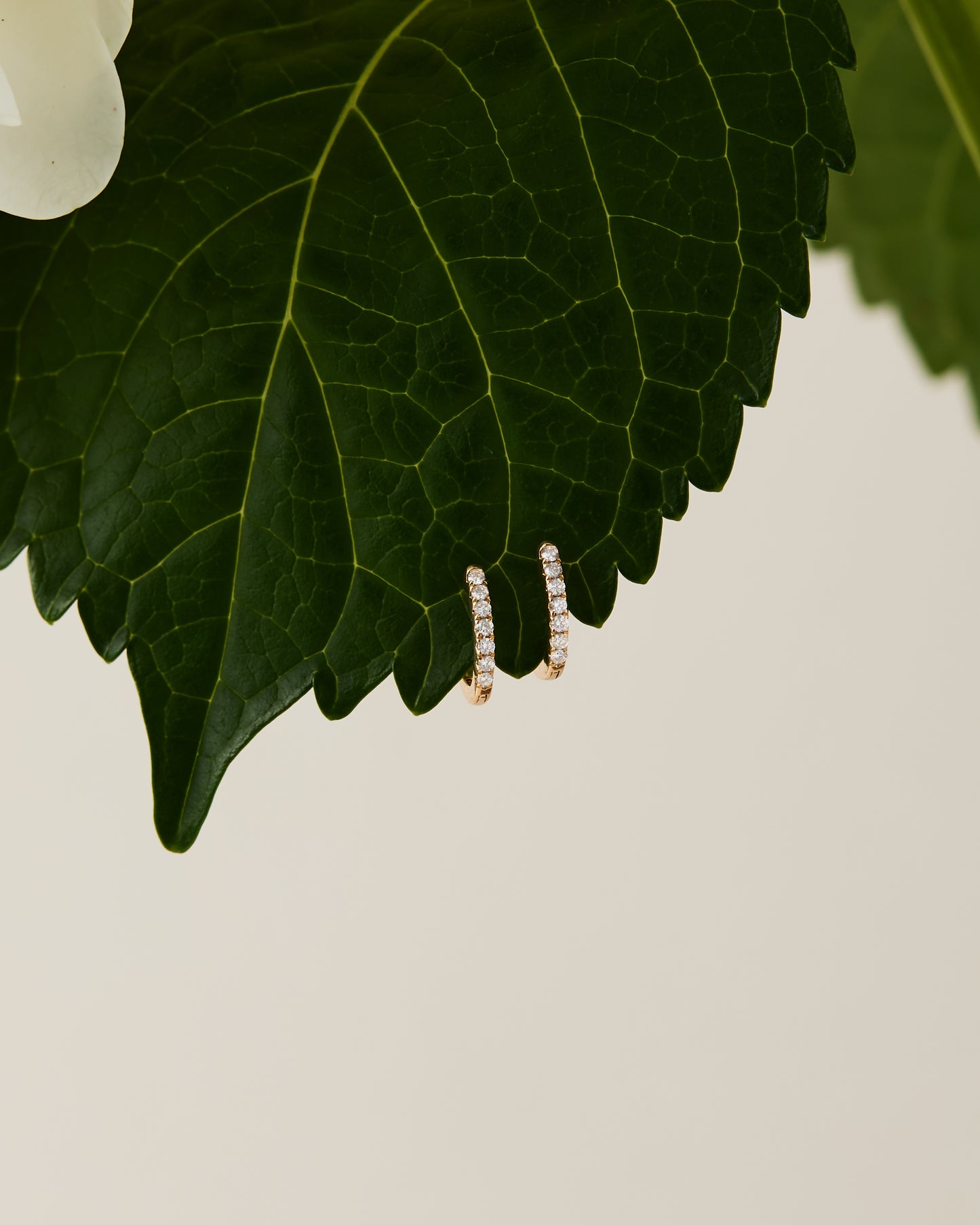 Dainty gold diamond huggie earrings, made in Nashville, TN