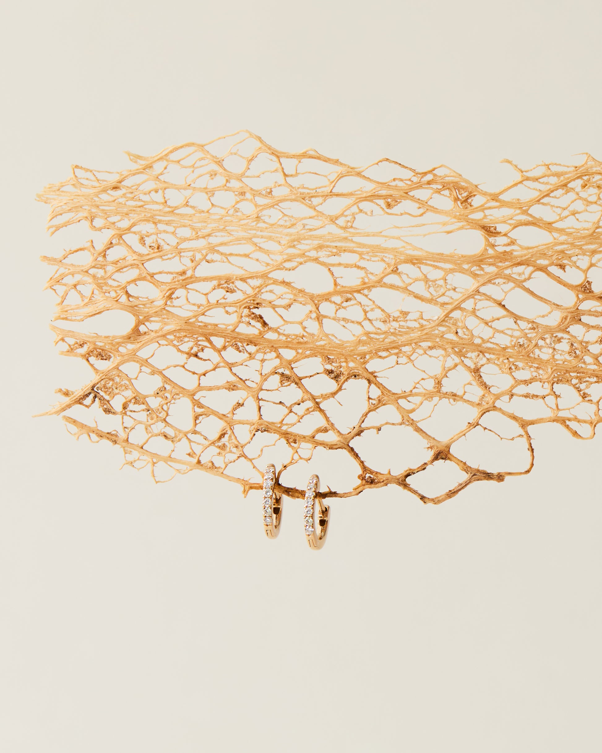 Dainty gold diamond huggie earrings, made in Nashville, TN